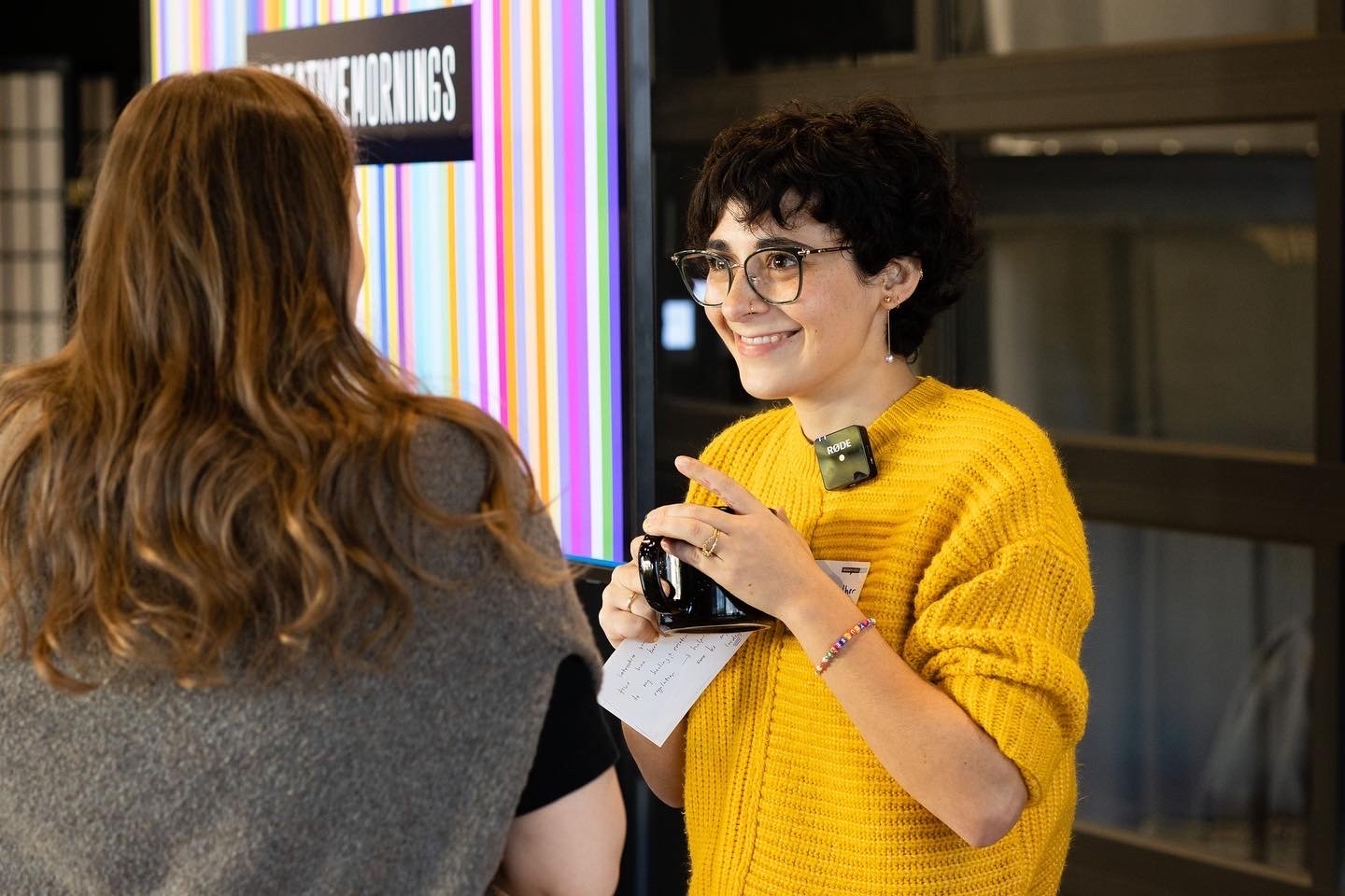 Isabel chatting with participants after giving a presentation on Truth & Authenticity at Creative Mornings Seattle